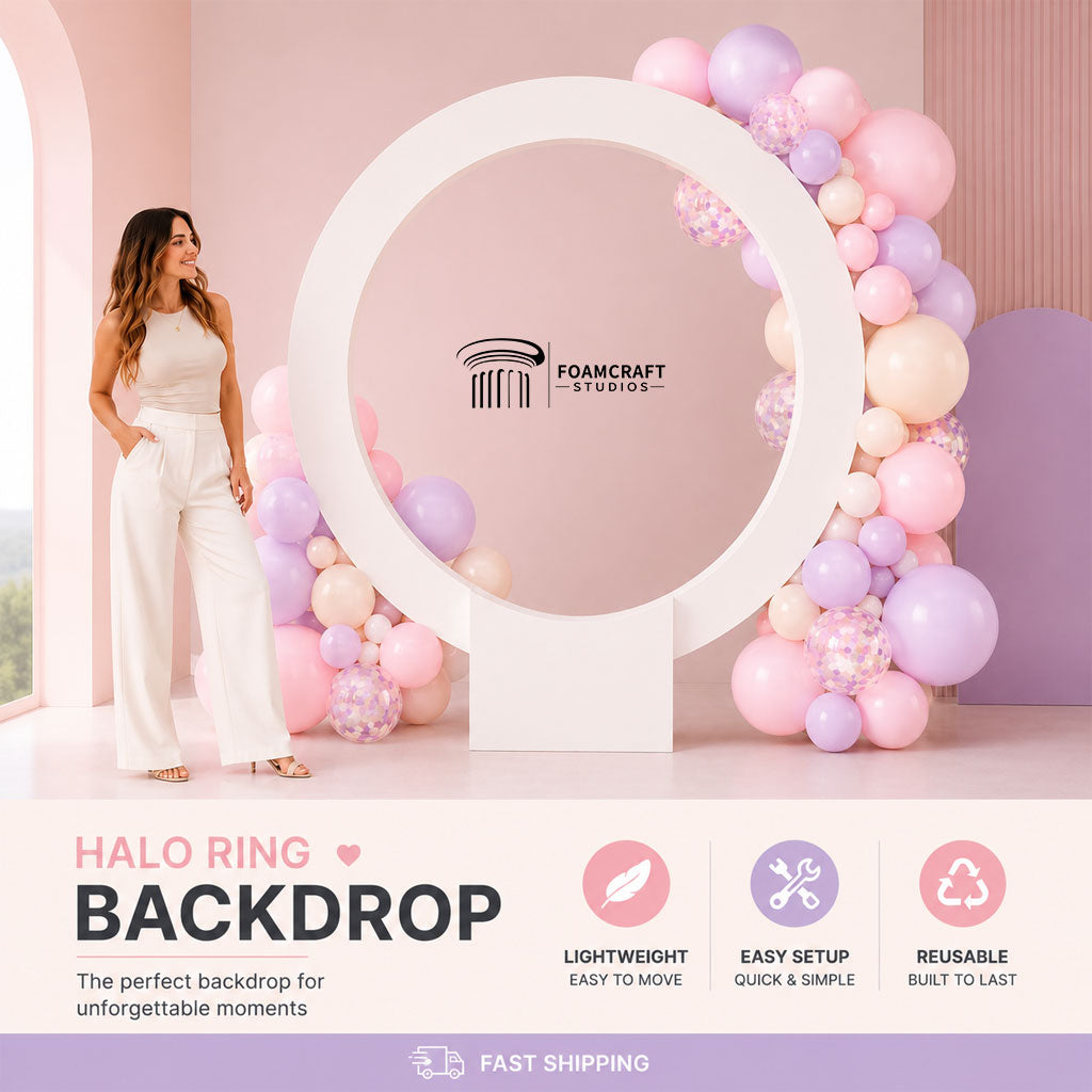 Pastel pink and lavender Halo Ring Backdrop setup with balloon garlands and female model for scale in a luxury party scene.