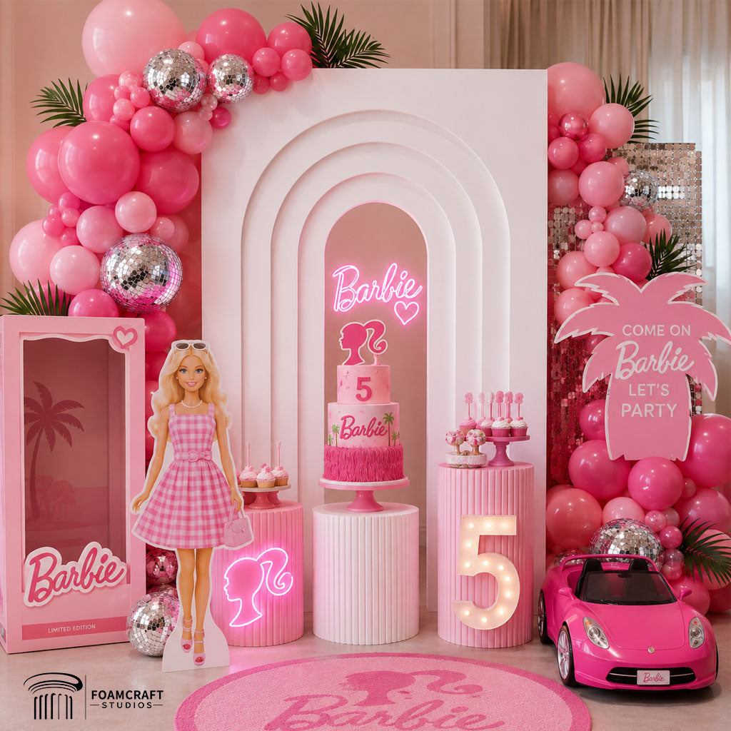 Pink Barbie-inspired birthday setup featuring the layered arch backdrop with pink balloons, cake, neon decor, and glamorous party decorations for a 5-year-old girl