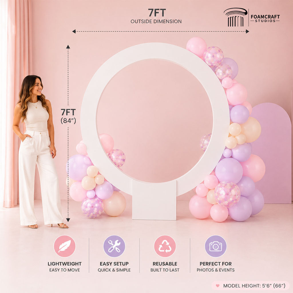 image showing the Halo Ring Backdrop with pastel balloons, female model for scale, and labeled 7ft outside dimensions