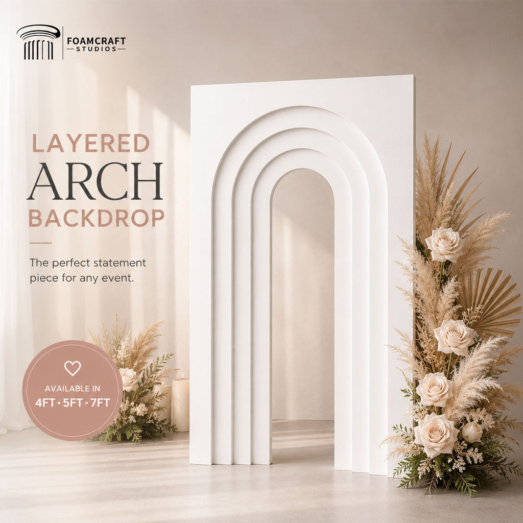 Elegant layered arch backdrop styled with soft floral decor and neutral event aesthetics, showcasing modern foam party backdrop design for weddings, birthdays, and celebrations